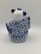 Statuette enfant au poisson en porcelaine