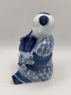 Statuette enfant au poisson en porcelaine
