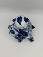 Statuette enfant au poisson en porcelaine