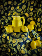 Pichet vintage en faïence émaillée jaune pastel